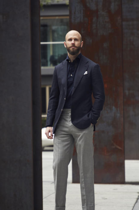blue blazer and grey trousers