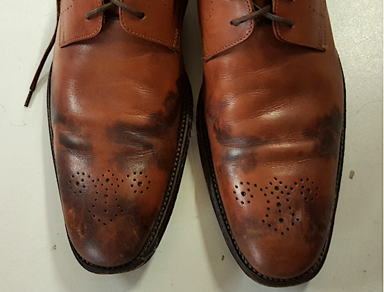 leather dress shoes in rain